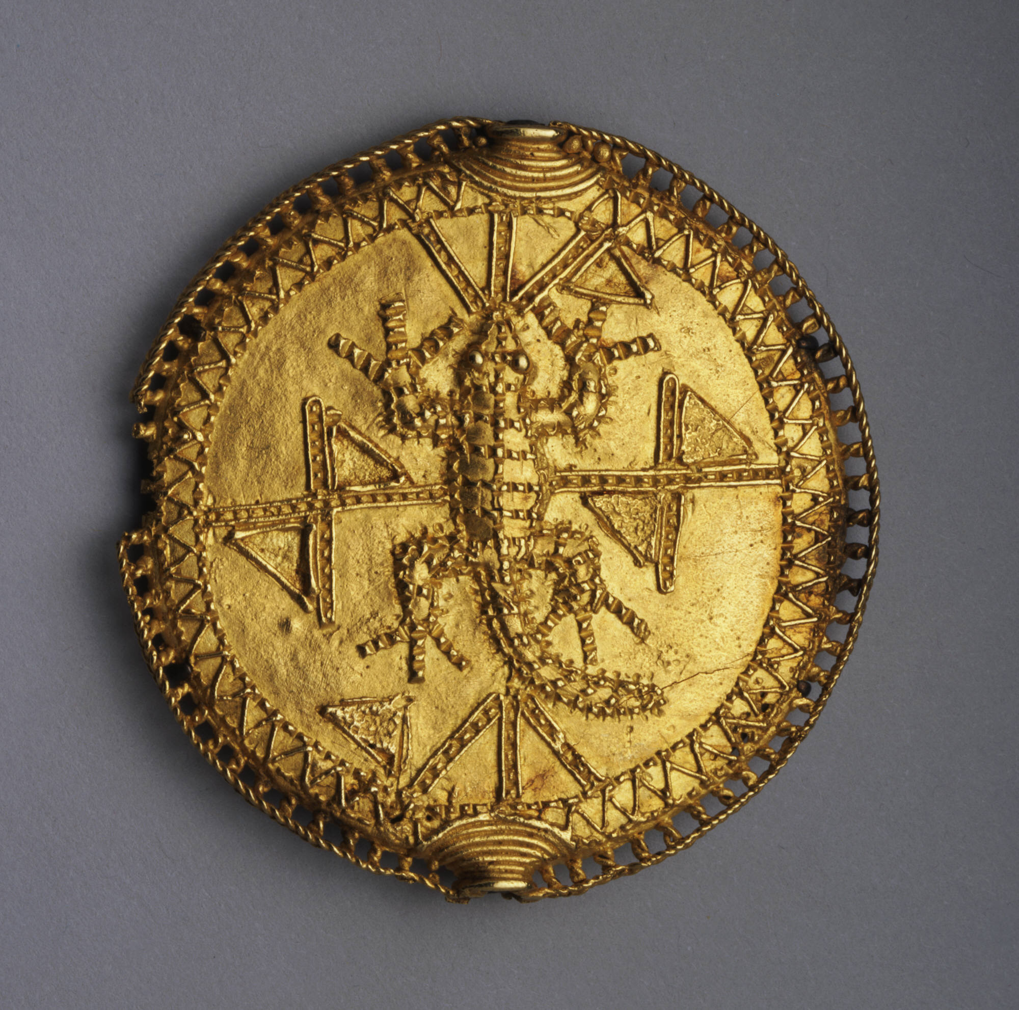 West Africa, Ghana. Akan (Asante) artist: Disk pendant or pectoral badge (akrafokɔnmu), late 19th century. Gold, diam. 7.2 cm. Museum purchase, Fowler McCormick, Class of 1921, Fund (y1982-17). Photo: Bruce M. White